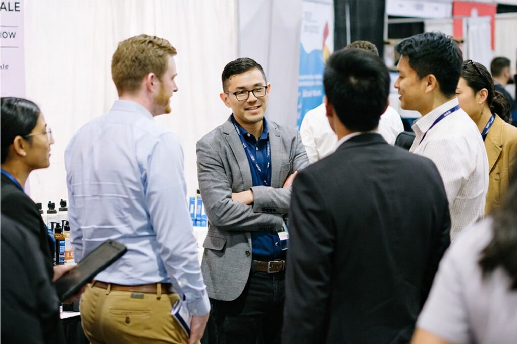 Individuals talking at tradeshow
